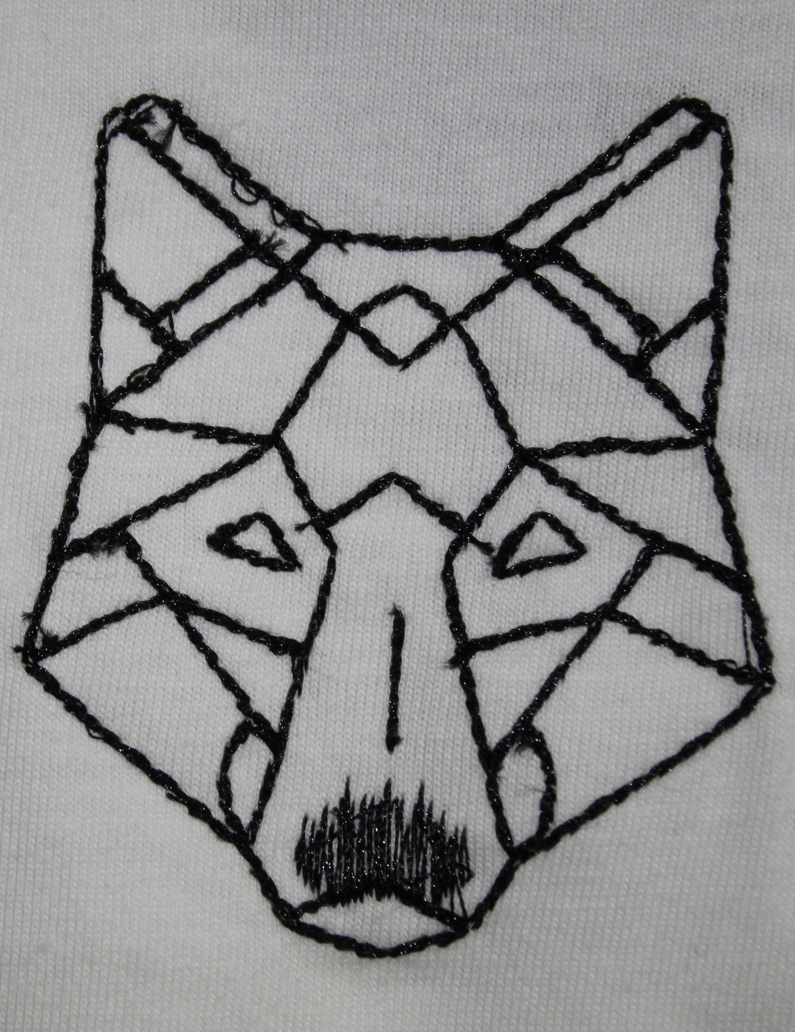 Geometric wolf head design on a white background